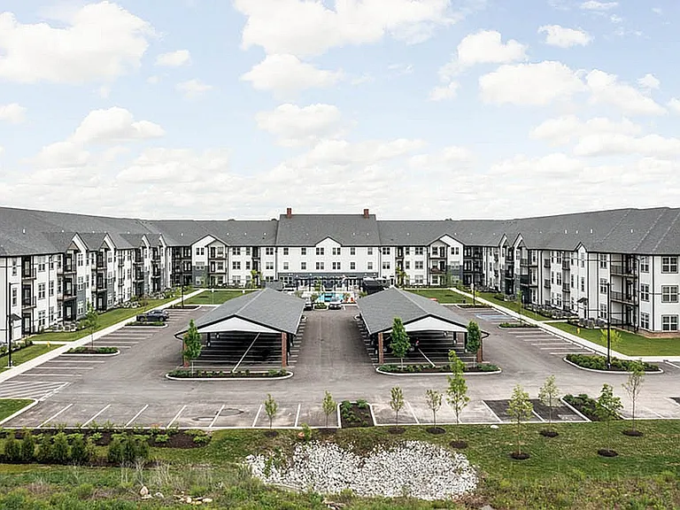 Apartment Exterior Featuring Parking