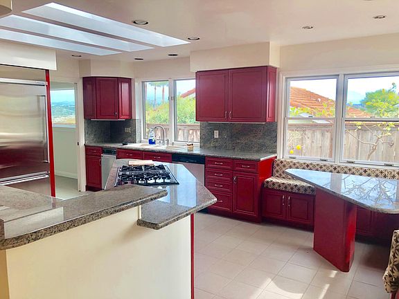 over sized refrigerator and built in breakfast nook