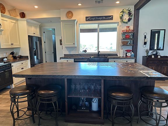 Huge 5' x 9' island and plenty of extra storage in island cabinet.