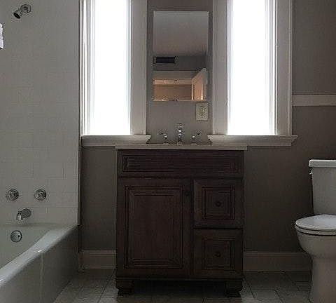Bathroom located behind bedroom
