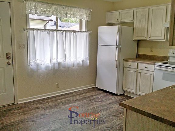 Kitchen and back entrance to patio.