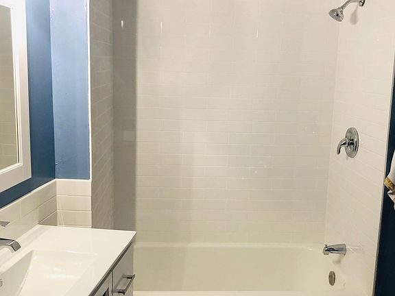 All new shower tile, refinished bath, and fixtures.