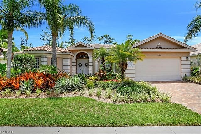 Tropical Front Yard ; New Driveway ; Attached 2-Car Garage
