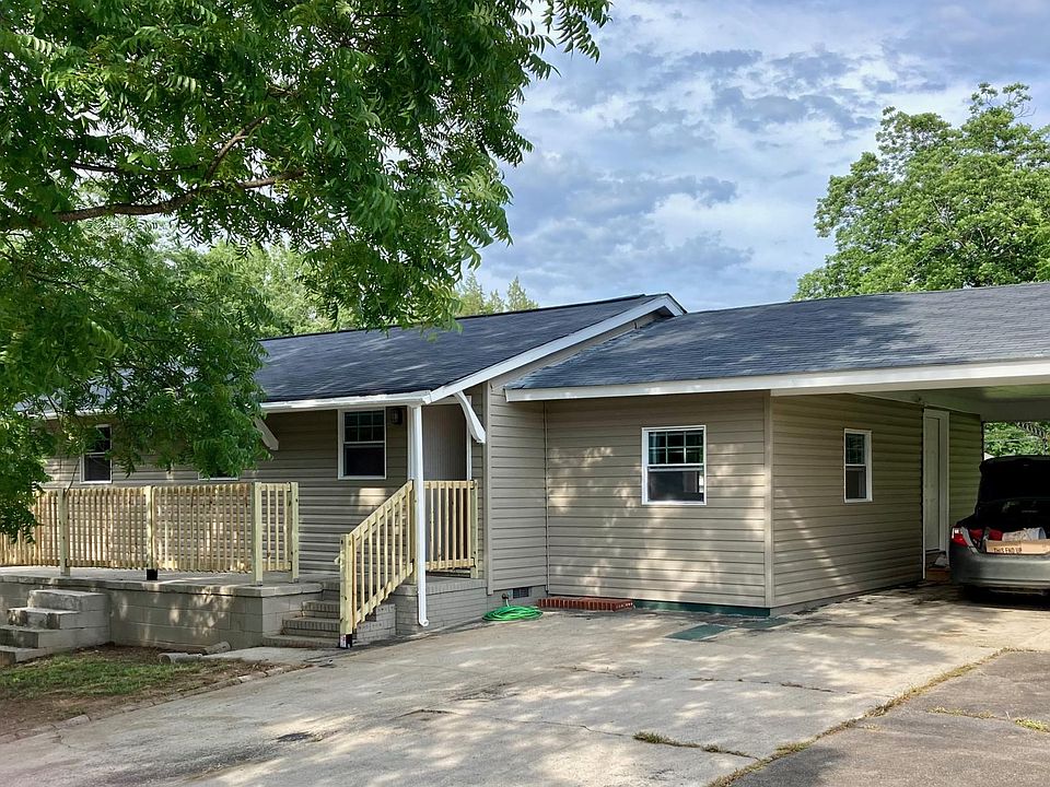 Front of home with 2-car carport