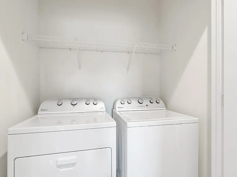 Washer & Dryer located right outside of 3 bedrooms.
