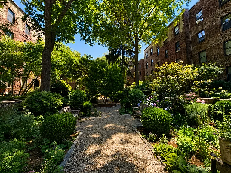 Large landscaped courtyard with benches.