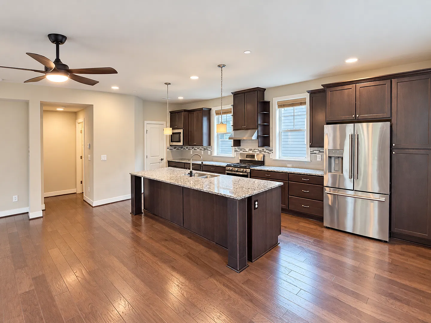Spacious Multi-Level Townhome with Attached Garage, Open-Concept Living & In-Home Laundry — Photo 3