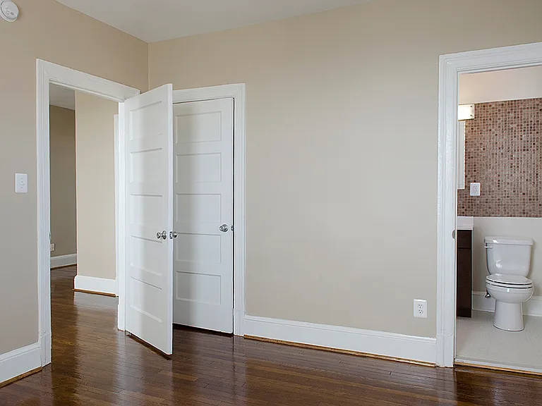 One-bedroom apartment bedroom and bathroom entrance
