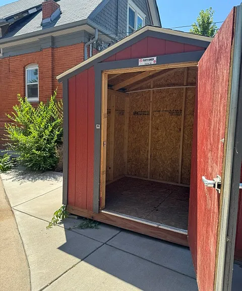 6 x 8 storage shed for your use. You provide your own lock.