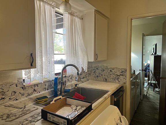 New tile backsplash and sink placed in the kitchen