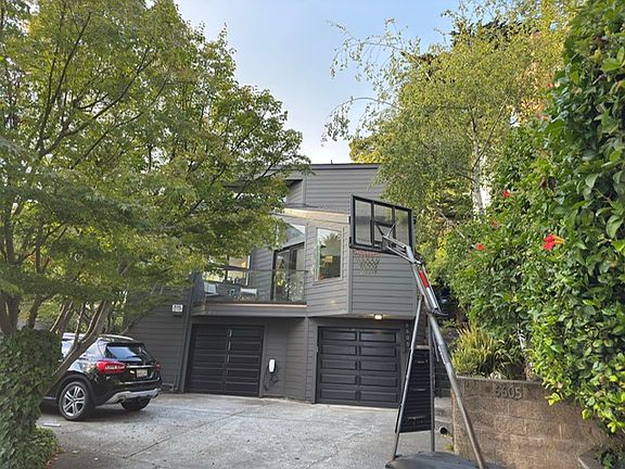Driveway with 3 parking spots & access to 2-car garage