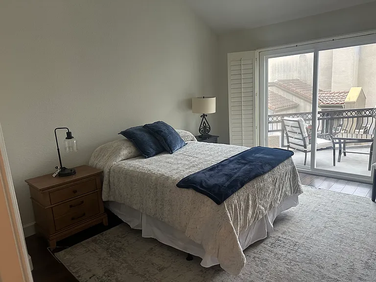 Master Bedroom w/ Deck. Artwork not on walls yet