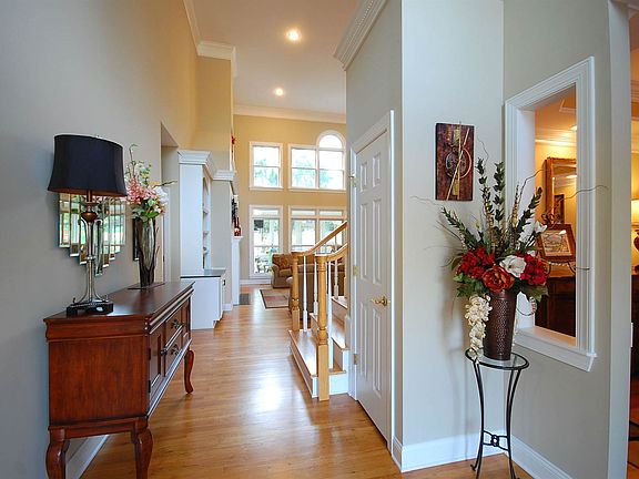 ENTRANCE FOYER LEADING TO LIVING ROOM
