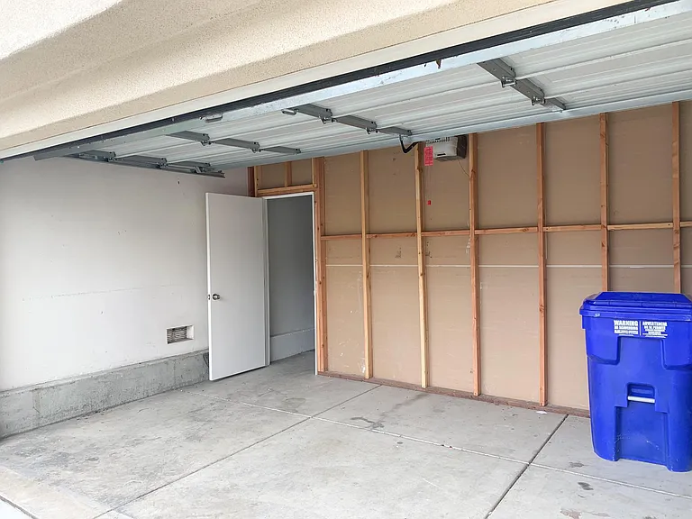 Garage turned into storage, 2-car driveway and plenty of street parking available