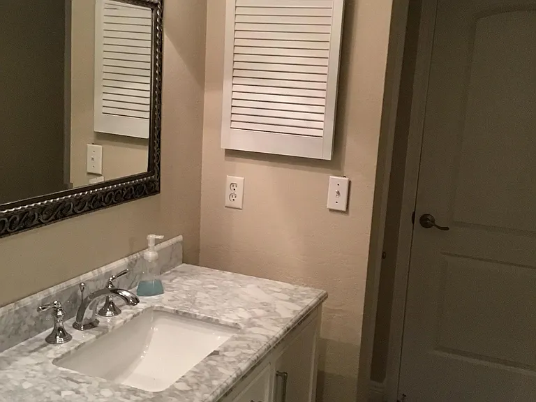 Bath 1, different view. Door leads to hallway. Can be used like a jack and jill bath, or locked for privacy.
