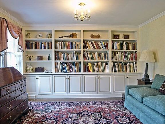 wonderful den off center hall with built-ins and wd floors