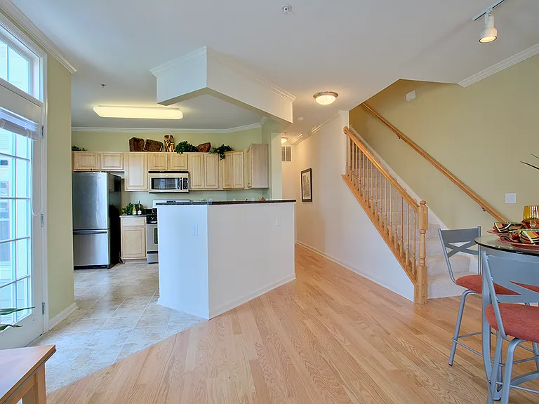 Townhome kitchen and dining area (staged)