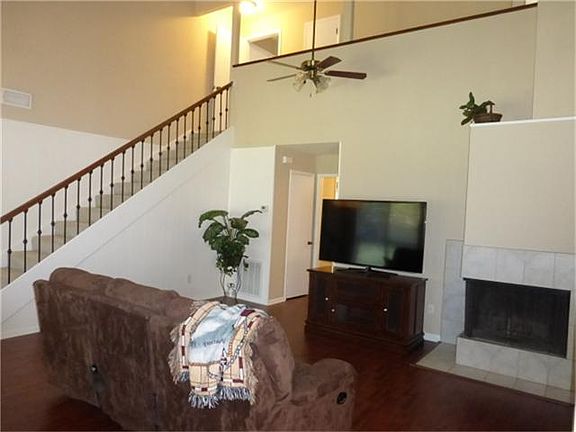 Amazing family room with soaring ceiling & wall of windows...