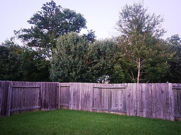 Outstanding views of the greenbelt and all the mature trees just outside the fenced backyard.