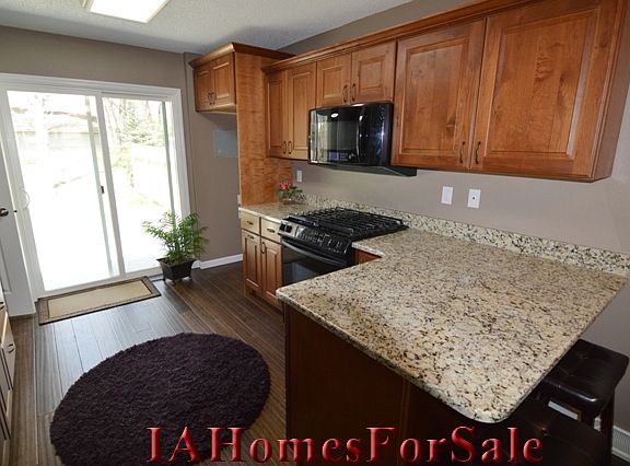 Kitchen- granite counter tops, gas stone, convection microwave oven and breakfast bar