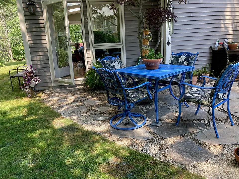 Patio off sunroom (ahead) and main bedroom (to the right)