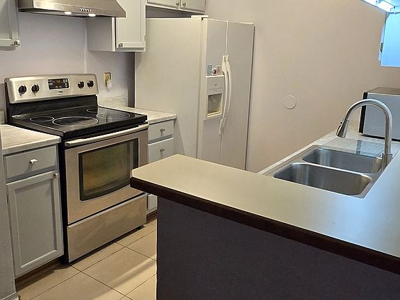 Upgraded cabinets and new countertops. Premium dishwasher, microwave, water-dispenser on refrigerator, ceramic top stove, lots of cabinet space. Breakfast nook.
