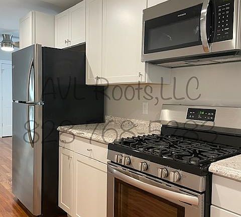 Full Kitchen with Plenty of Cabinets and a Large Pantry.