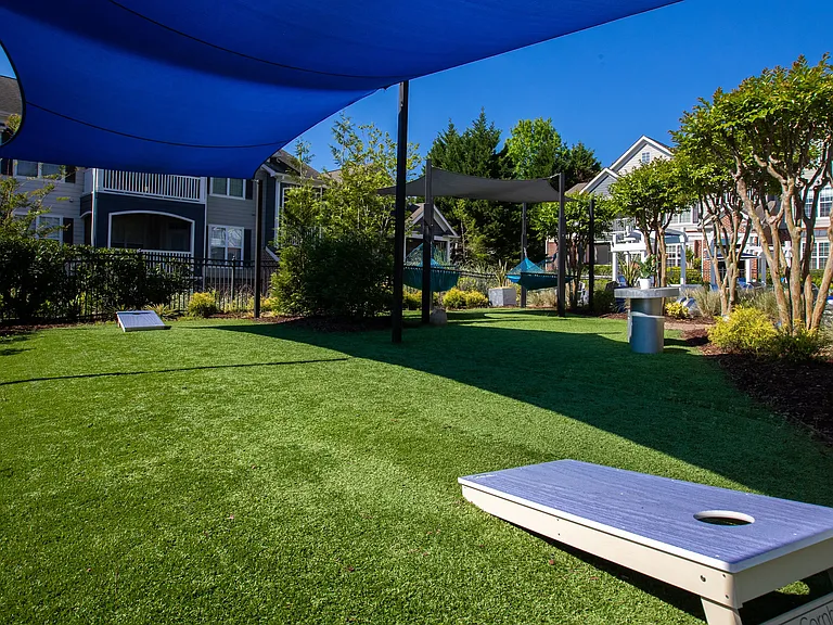 Engage in a spirited game of cornhole amidst the vibrant buzz of The Everlee's dynamic pool deck.