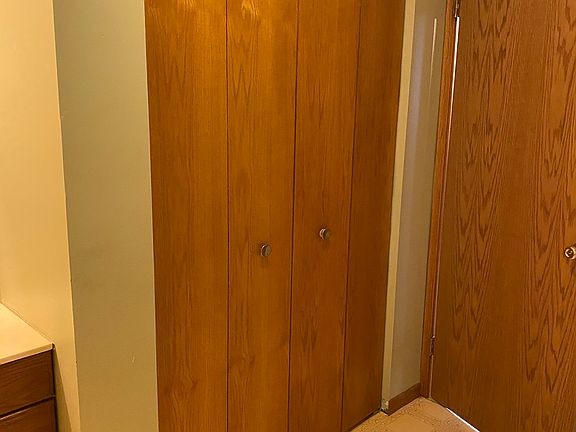 Bathroom closet with shelvin