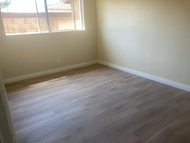 2 of 2 bedrooms.. lots of light from large window, drapes are provided