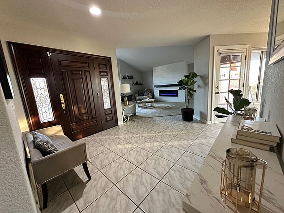 Front entryway and view of formal living room