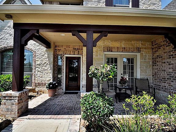  ENJOY THE COVERED FRONT PORCH WITH CEDAR BEAMS