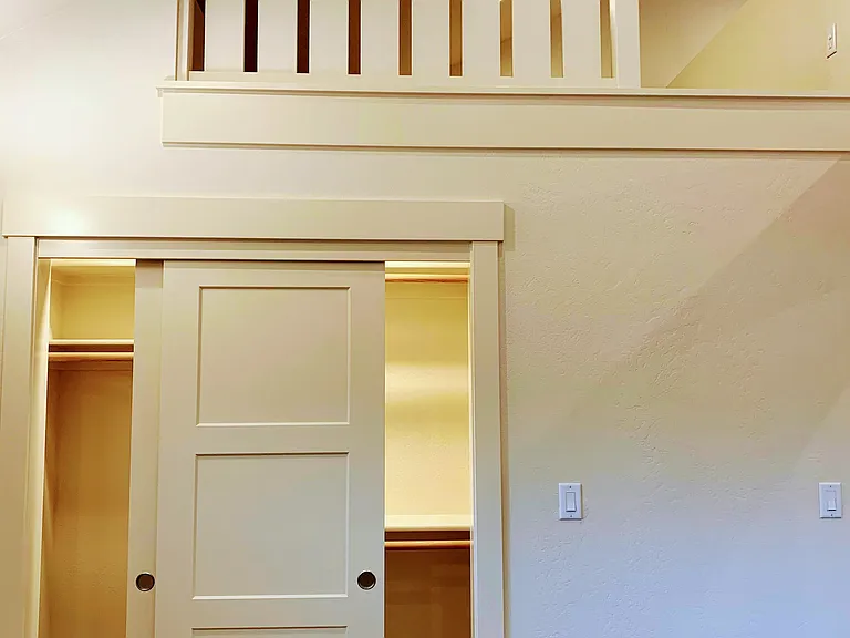 View of closet and loft from bedroom.