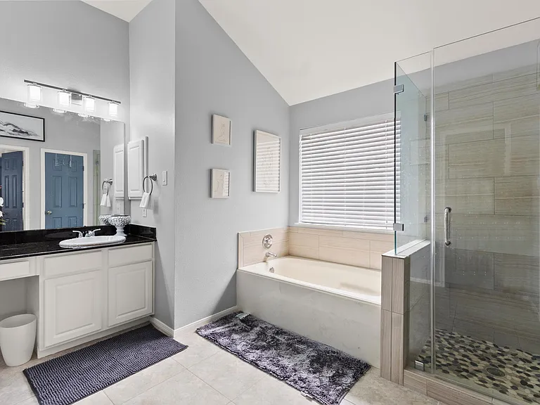 Huge master bathroom with her and his sink, Double size bathtub, stand shower and separate area toilet