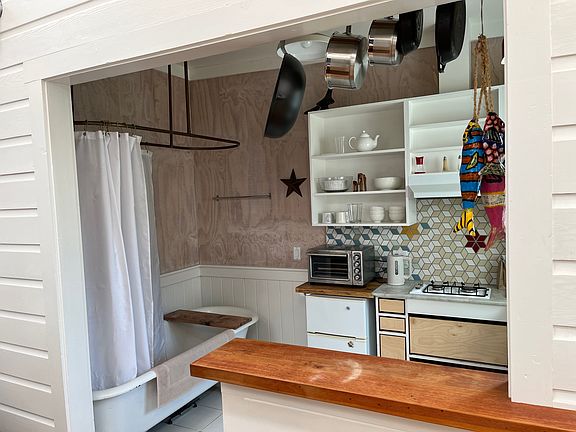 Kitchen with a full 6 foot clawfoot bathtub and shower