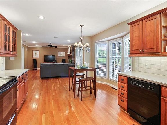 What a fabulous space to gather with family and friends.  The open kitchen and family room have gleaming hardwood floors and amazing views of the golf course.