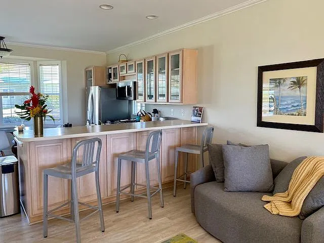 kitchen counter with bar stools
