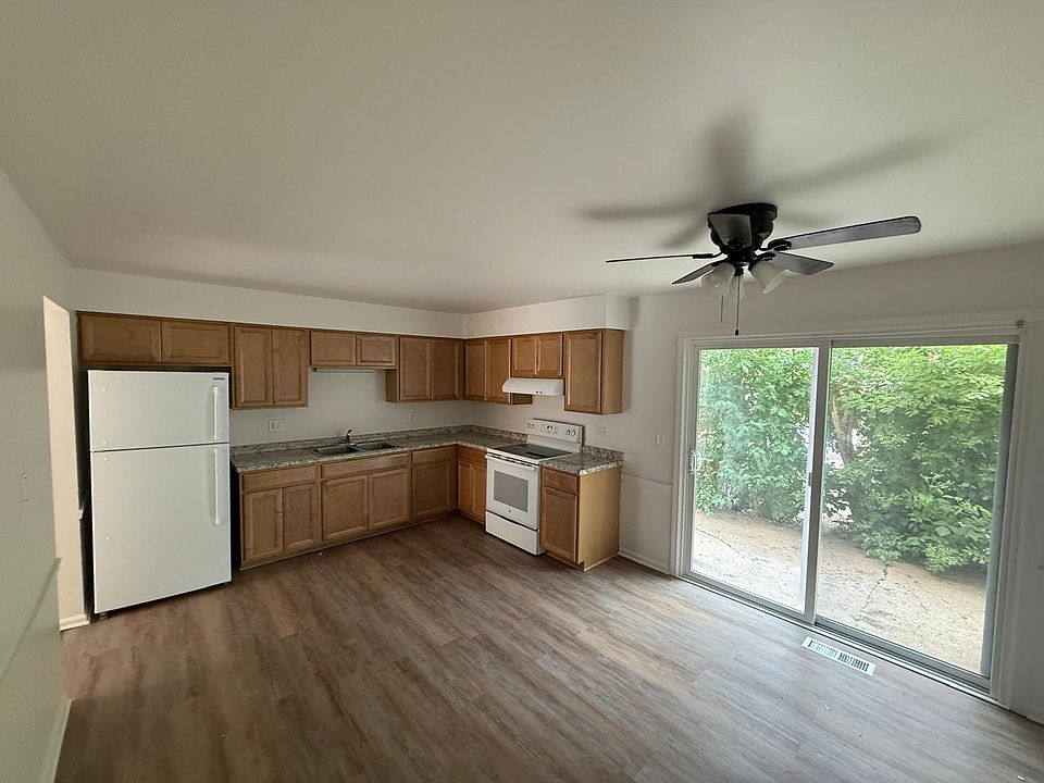 Modern kitchen with fresh paint and brand new floors.