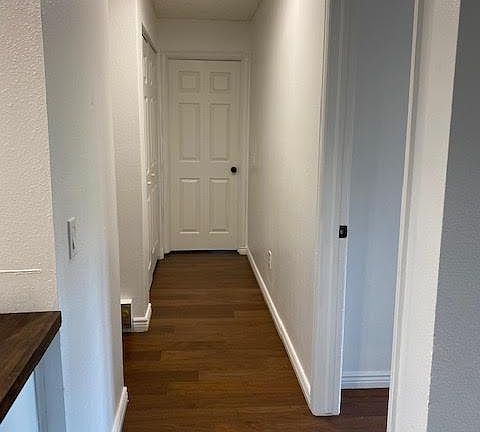 Hallway leading to bedrooms, 2nd bath and laundry