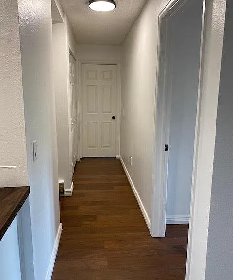 Hallway leading to bedrooms, 2nd bath and laundry