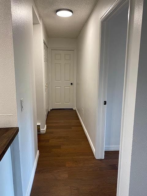 Hallway leading to bedrooms, 2nd bath and laundry