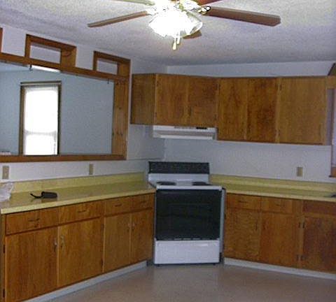 Kitchen looking into living room. Large open view, over the counter.