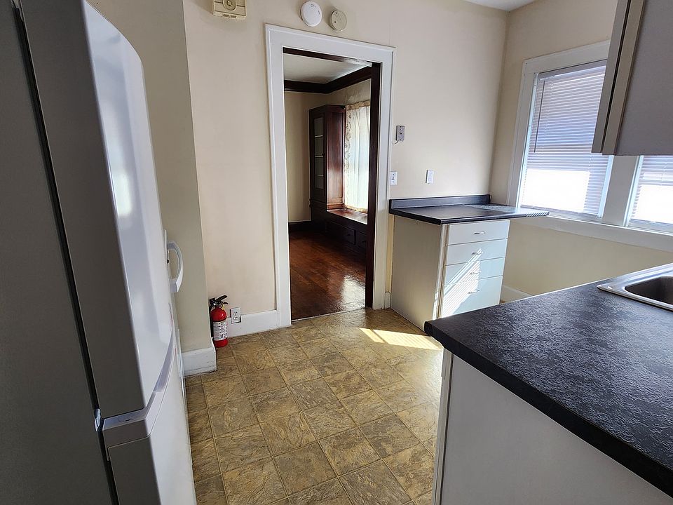 Kitchen with updated features and cabinets with dishwasher, fridge/freezer and range