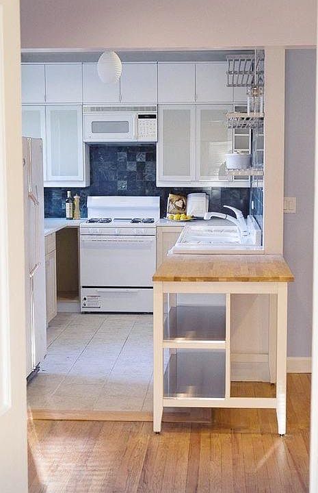 kitchen, unfurnished, east view. Includes breakfast bar with wooden counter