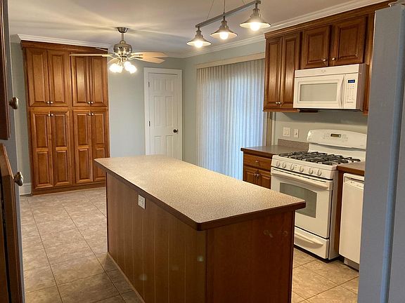 Entry to kitchen from side door. Door at right rear is also pantry.