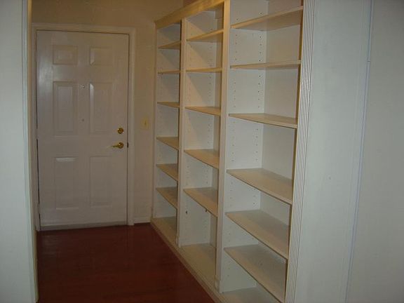 Bookshelves lining the hallway entrance