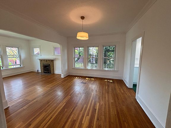 Decorative fireplace in living room; dining room.