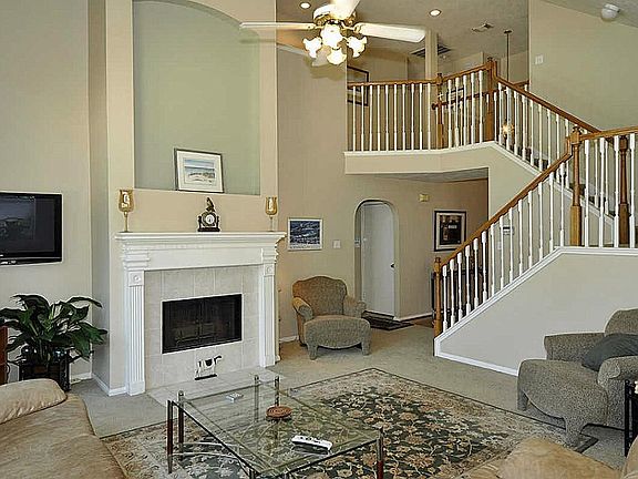 View of living room from kitchen looking toward master bedroom & foyer area.