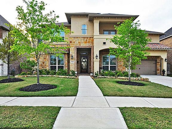 Better than new construction, stucco/stone home with gorgeous curb appeal