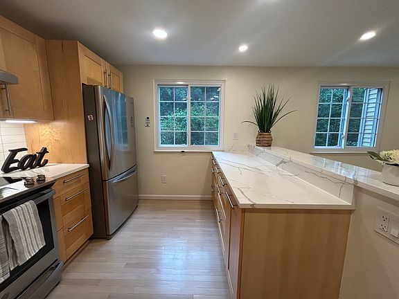 Kitchen and dining room back to woods